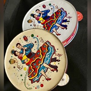 2 Vintage flamenco dancers art, tin  lithographed toy tambourines/ nose makers.